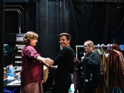 Costume Assistants fitting costume on an actor
